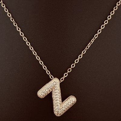 The Pavé Initial Pendant: A Personal Statement in Gold